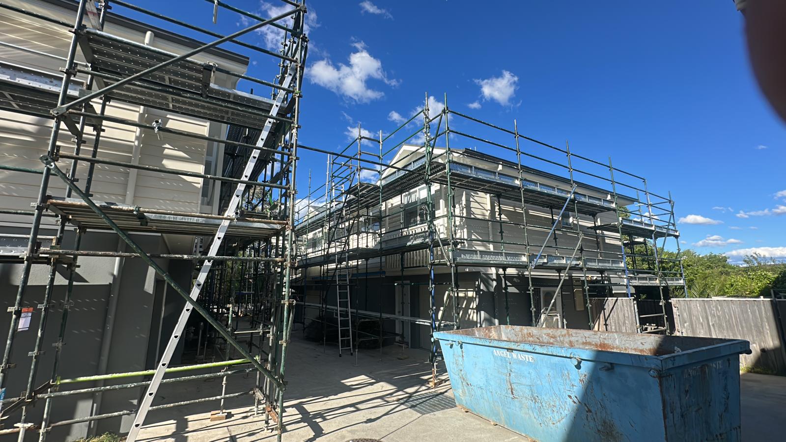 Scaffold containment mesh on perimeter of industrial project