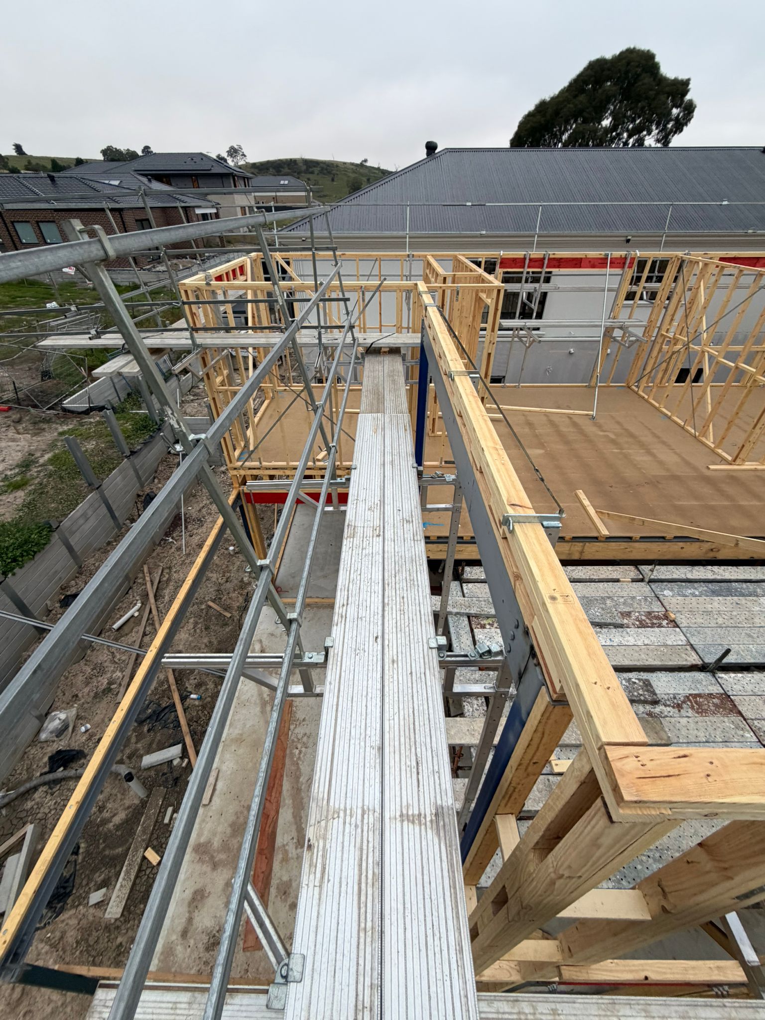 Two plank walkway scaffold installed between work areas